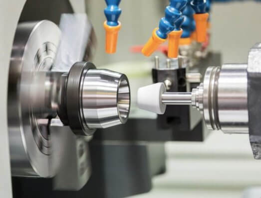 Precision surface grinding machine finishing a steel part